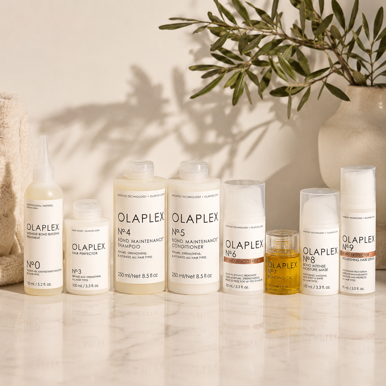 Complete Olaplex haircare routine featuring No.0 to No.9 bond-building products for damaged, coloured and chemically treated hair.