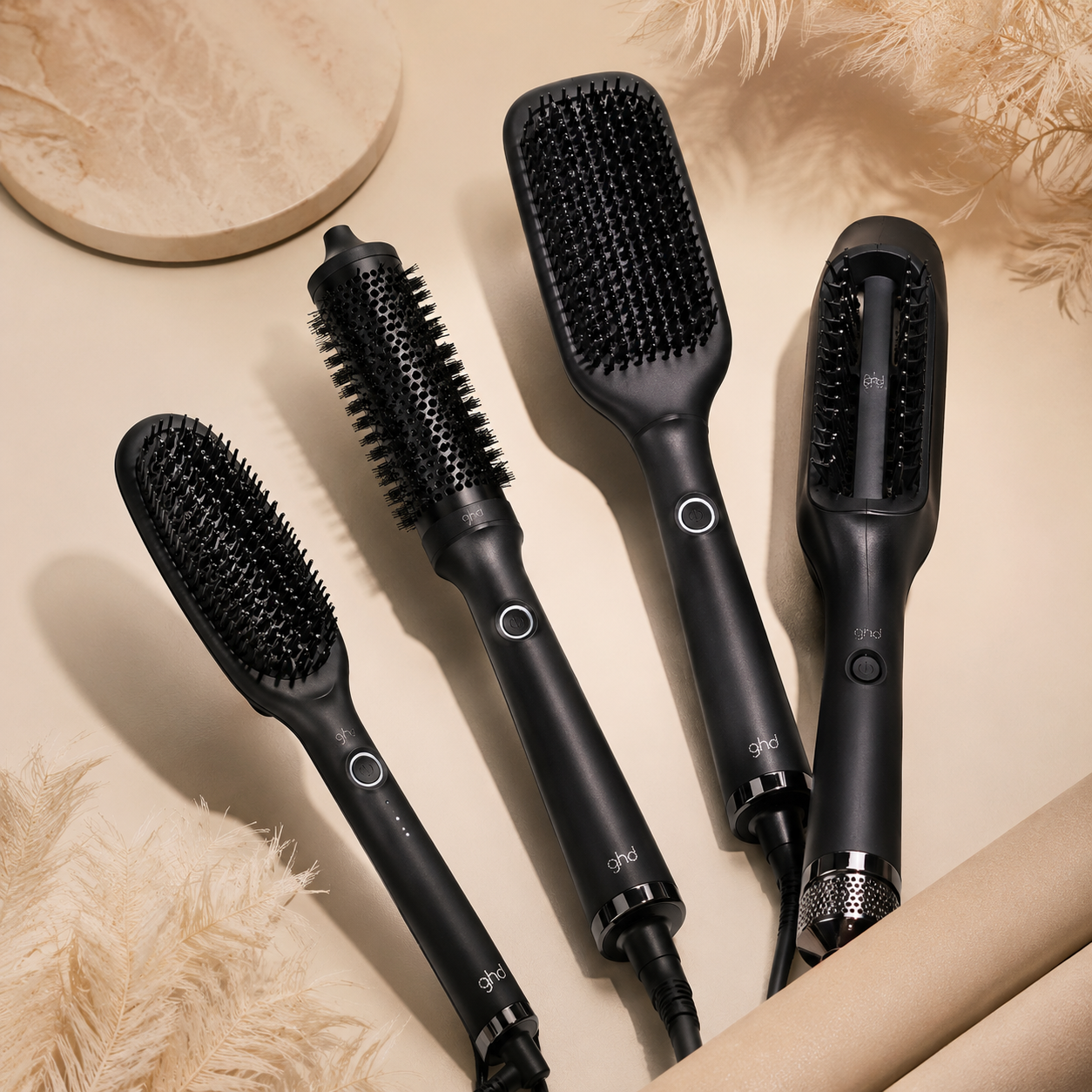 Professional ghd hot brushes including smoothing, volumising and wet-to-dry styling tools for salon-quality hair results at home.