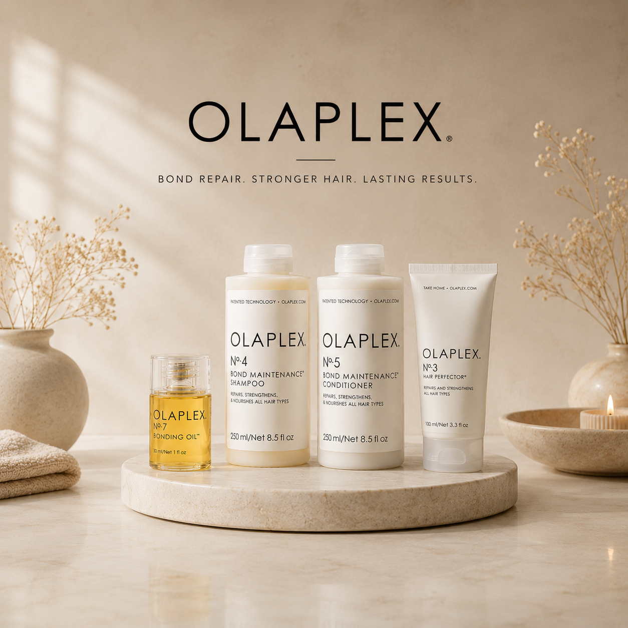 Olaplex hair care products on a wooden surface with a neutral background