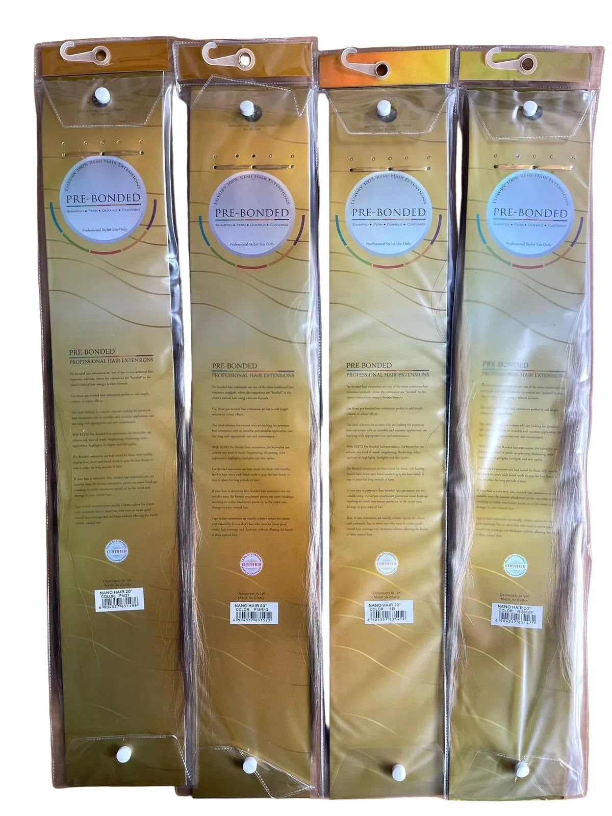 Four packages of pre-bonded nano tip hair extensions on a wooden surface
