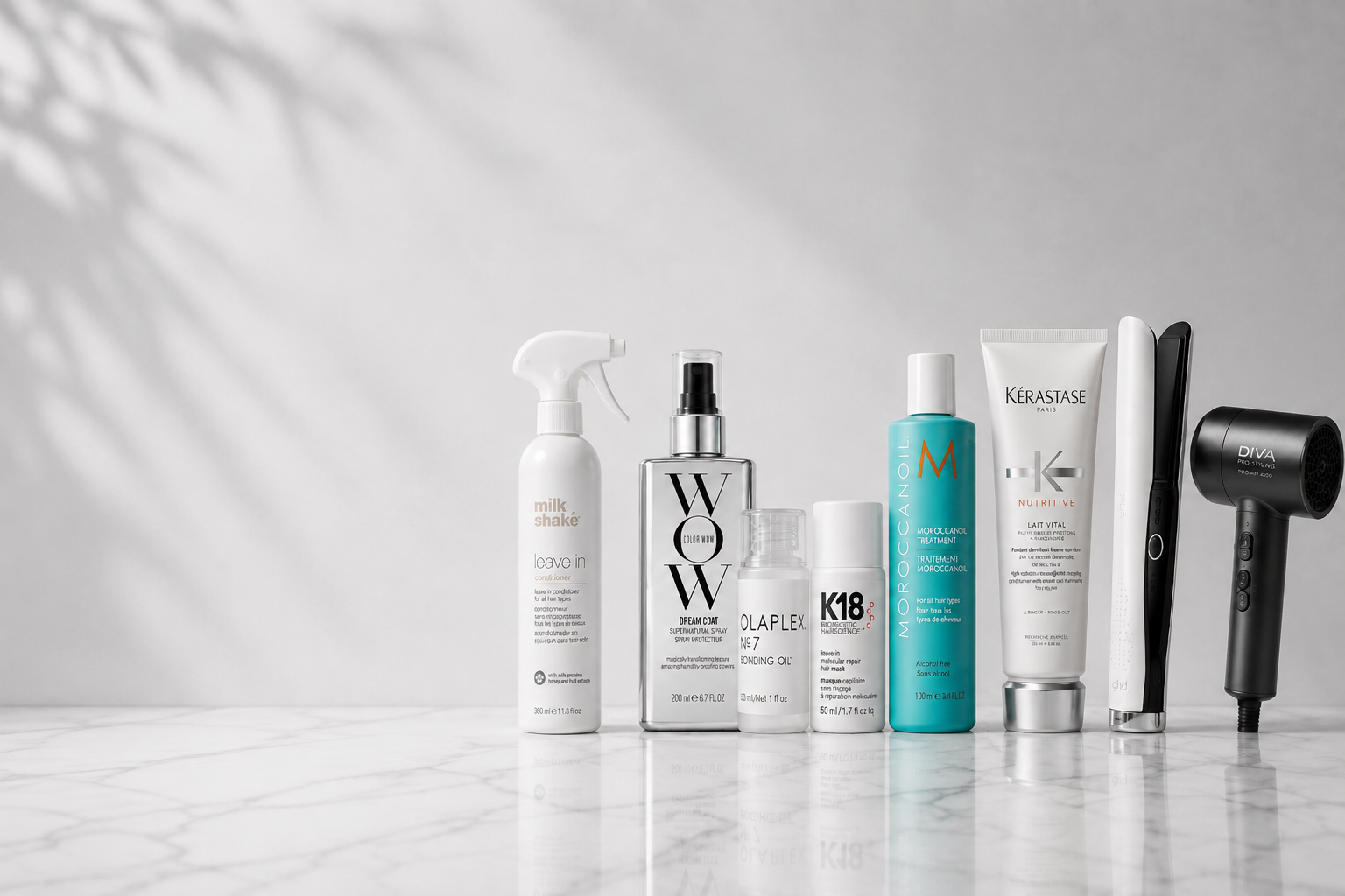 Professional haircare and styling products from milk_shake, Color Wow, Olaplex, K18, Moroccanoil, Kérastase, ghd and Diva on a clean white and grey background.